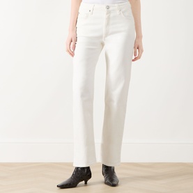 Model wearing Rag & Bone Miramar Harlow Ankle Straight-Leg Jeans in white, styled with black ankle boots