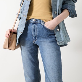 Model wearing Rag & Bone Straight Jeans in accord blue denim, styled with a denim jacket, mustard top and neutral tote bag.