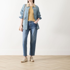 Model wearing Rag & Bone Straight Jeans in accord blue, styled with a denim shirt and mustard top, beige boots.
