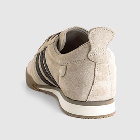 Adidas trainer in Crystal Linen, suede upper with dark brown stripe detailing, gum sole, rear three-quarter view.