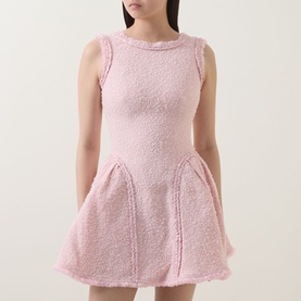 Model wearing Self-Portrait pink boucle sleeveless mini dress with fitted bodice and flared skirt
