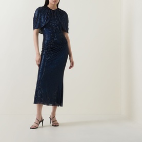 Model wearing Self-Portrait navy blue sequin midi dress with ruched bodice and puff sleeves, styled with black strappy heels