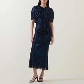 Model wearing Self-Portrait Navy Blue sequin midi dress with draped neckline and short flutter sleeves, styled with black heeled sandals.