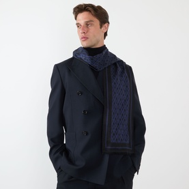 Model with Valentino Monogram Oblong Scarf in nero/blu navy silk, styled over a dark double-breasted coat