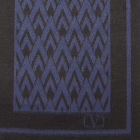 Valentino silk pocket square in nero and blu navy, featuring a geometric chevron jacquard pattern with contrast border edge.
