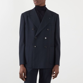 Model wearing Valentino storm blue wool double-breasted blazer with dark buttons, styled with a black roll-neck top
