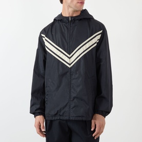 Model wearing Valentino dark marine casual jacket with beige chevron stripe detail, hood, and zip fastening