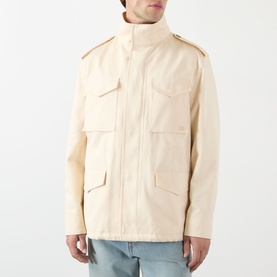 Model wearing Valentino sea shell cotton casual jacket with epaulettes, four patch pockets and zip fastening, styled with light blue jeans