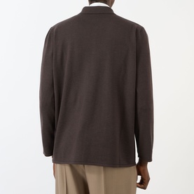 Model wearing Valentino Patch Pocket Knitted Polo Cardigan in brown, back view, styled with beige trousers.