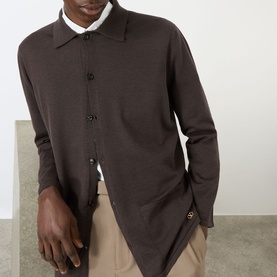 Model wearing Valentino Patch Pocket Knitted Polo Cardigan in brown, with polo collar and front button fastening, styled with beige trousers