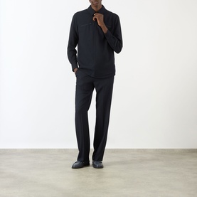 Model wearing Valentino Chest Pocket Zip Overshirt in storm blue wool, styled with black wide-leg trousers and dark shoes.