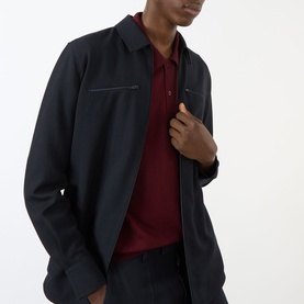 Model wearing Valentino Chest Pocket Zip Overshirt in Storm Blue wool, styled with a burgundy polo shirt underneath.