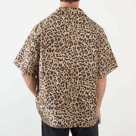 Model wearing Valentino Multicolor Animalier silk casual shirt, rear view, relaxed fit with camp collar, styled with dark trousers