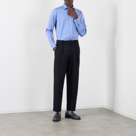 Model wearing Valentino Cloudless Sky cotton casual shirt with black tailored trousers and dark leather loafers.