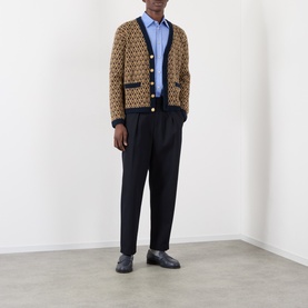 Model wearing Valentino Cloudless Sky cotton casual shirt, styled with brown monogram cardigan and navy tailored trousers.