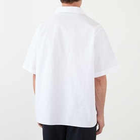 Model wearing Valentino white short-sleeve cotton casual shirt, rear view showing relaxed fit and spread collar