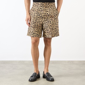 Model wearing Valentino Multicolor Animalier silk shorts with leopard print, styled with black loafers