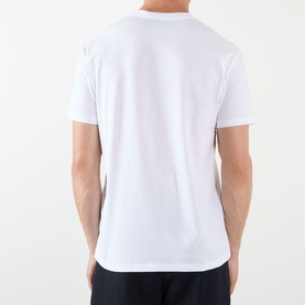Model wearing Valentino white cotton T-shirt, rear view showing clean crew neck and short sleeves