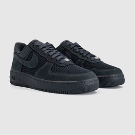 Nike Air Force 1 low-top trainers in anthracite, featuring suede and mesh upper with tonal lacing and black rubber sole.