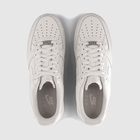 Nike Air Force 1 trainers in sail white, leather upper with perforated toe box, overhead flat lay showing both shoes, white sole