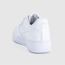 Nike Air Force 1 in white patent leather, low-top trainer with white rubber cupsole, heel and Swoosh logo detail visible.