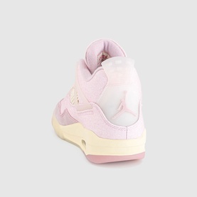 Nike trainer in Iced Carmine, featuring pink textile upper, cream midsole and Jumpman logo, rear three-quarter view.