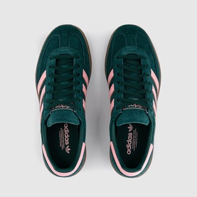 Adidas trainers in collegiate green suede with pink three-stripe detailing, white midsole, and gum outsole, top-down view