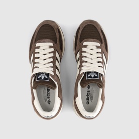 Adidas trainers in Earth Strata Brown, overhead view showing suede and mesh upper with cream stripe, white laces and gum sole.