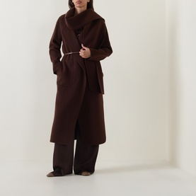 Model wearing Luisa Cerano dark brown longline coat with wide lapels and belted waist, styled with matching wide-leg trousers.