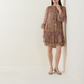 Model wearing Luisa Cerano Tiered Floral Print Mini Dress in multi, with stand collar, front tie, flared cuffs and tiered ruffle skirt, styled with