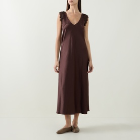 Model wearing Luisa Cerano dark brown satin midi dress with V-neck and ruffle cap sleeves, styled with taupe flat mules.