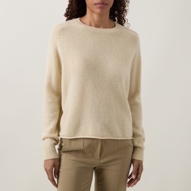 Model wearing Luisa Cerano Fine Knit Sweater in yellow, crew neck, long raglan sleeves, fine knit with ribbed trims, styled with tailored trousers