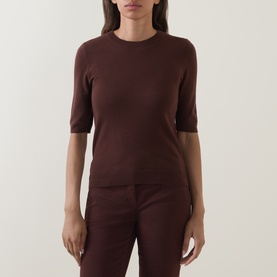 Model wearing Luisa Cerano dark brown short-sleeve fine knit top, styled with matching dark brown trousers.