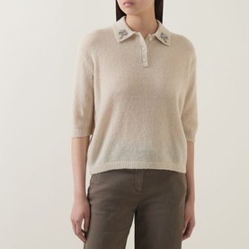 Model wearing Luisa Cerano Embellished Knitted Polo Sweater in Ginger with star embellishment on collar, styled with khaki trousers
