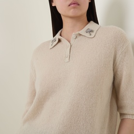 Model wearing Luisa Cerano Embellished Knitted Polo Sweater in Ginger, featuring jewelled collar detailing and three-button placket.