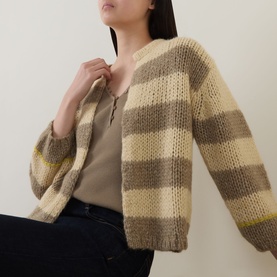 Model wearing Luisa Cerano Open-Front Striped Cardigan in multi, beige and taupe stripes, brushed knit, dropped shoulders, styled over neutral vest
