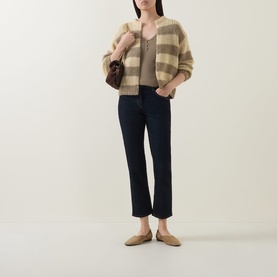 Model wearing Luisa Cerano Open-Front Striped Cardigan in multi, styled with dark jeans, tan top, and flat mules, carrying small brown bag.