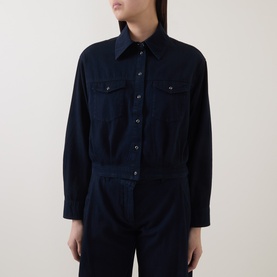 Model wearing Luisa Cerano Blouson Denim Blouse in dark blue with shirt collar, chest flap pockets, and elasticated hem, styled with matching dark