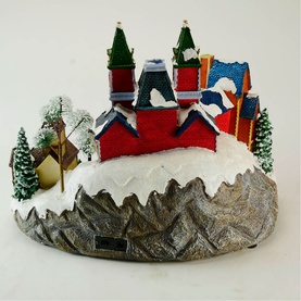 Music Box World Musical Christmas Village House Decoration, 30cm, multicoloured polyresin with snowy rooftops, green trees, and rocky base