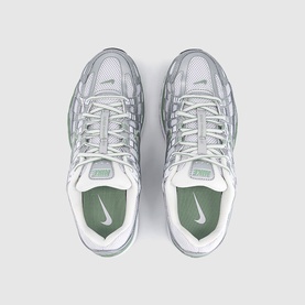 Nike trainers in metallic silver and white, mesh and synthetic upper, white lace-up fastening, sage green insole and Swoosh logo, overhead view