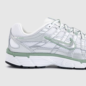 Nike P-6000 trainer in white and metallic silver with sage green overlays, chunky white sole and silver Swoosh logo detail