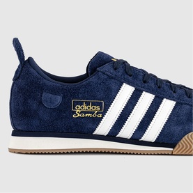 Adidas Samba trainer in Night Indigo and Chalk White suede, white three stripes, gold logo badge, gum sole