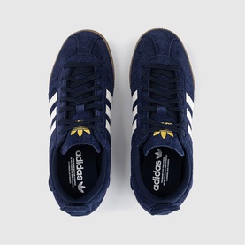 Adidas trainers in Night Indigo and Chalk White suede, white three-stripe detail, gold logo, gum sole, overhead flat lay view