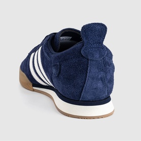 Adidas navy suede trainer, rear view, white three-stripe detail, gum sole and cream midsole, Night Indigo colourway