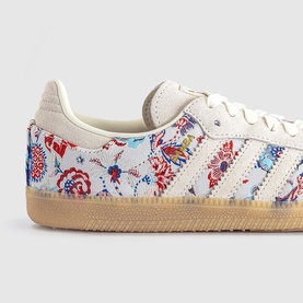 Adidas Gazelle trainers in Liberty Off White with floral print panels, cream three stripes, and gum sole