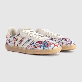 Adidas Liberty Off White Gum trainers with all-over floral print upper, three-stripe detail, and gum sole