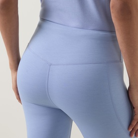 Model wearing Sweaty Betty leggings in Laguna Blue Marl, close-up of high-waisted back seam detail