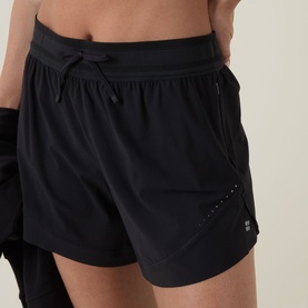 Model wearing black running shorts with drawstring waistband and perforated side panel detail, paired with black top and gloves.