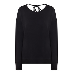 Sweaty Betty After Class Open Back Tie Sweatshirt in black, featuring open back with tie detail and ribbed cuffs
