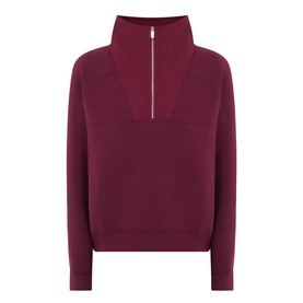 Sweaty Betty Wind Down Textured Half-Zip Sweatshirt in Merlot Red with silver zip, high neck, and raglan sleeves